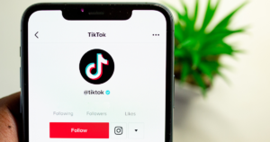 How to make money on TikTok for FREE- TikTok Logo and a cellphone